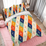 Atomic harlequin duvet cover set on a bed with a pink rug and gray curtains