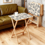 Black Toile de Jouy retro TV tray set of 4, in a living room beside an olive sofa