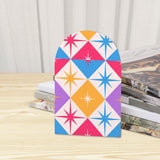 Close-up of the Star Diamonds retro wooden bookend beside stacked magazines