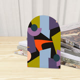 Close-up of the Abstract Shapes retro wooden bookend beside stacked magazines