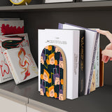 Quirky Faces retro wooden bookend on a dark shelf with books
