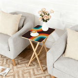 Rainbow Arcs 70s retro TV tray set of 4, next to a grey sofa with flowers