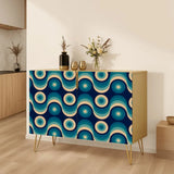 Retro wooden cabinet with blue and teal retro circle doors and hairpin legs with a vase of flowers on top in a warm room