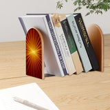 Orange Sunburst retro bookend holding books on a wooden desk next to a pen