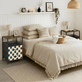 Retro circles nightstand next to a bed in a cozy bedroom