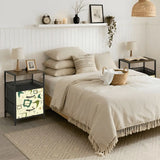 Green atomic boomerang nightstand next to a bed in a cozy bedroom