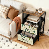 Green atomic boomerang side table with open drawer and books next to a sofa
