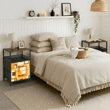 Orange squares retro nightstand next to a bed in a cozy bedroom