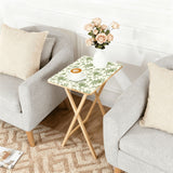 Sage Garden Floral retro TV tray set of 4, next to a grey sofa with flowers