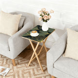 Gold Ginkgo retro TV tray set of 4, next to a grey sofa with flowers