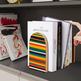 Rainbow Stripe retro wooden bookend on a dark shelf with books