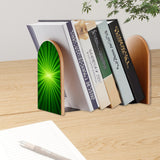 Green Sunburst retro bookend holding books on a wooden desk next to a pen