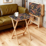 Navy Paisley retro TV tray set of 4, in a living room beside an olive sofa