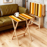 Brown Gold Stripes retro TV tray set of 4, in a living room beside an olive sofa