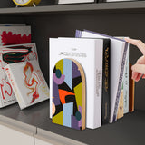 Abstract Shapes retro wooden bookend on a dark shelf with books