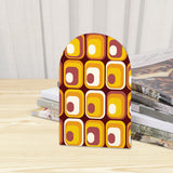 Close-up of the Amber Squares retro wooden bookend beside stacked magazines