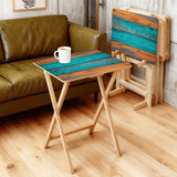 Teal Wood Grain retro TV tray set of 4, in a living room beside an olive sofa