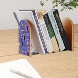 Jazz Music retro bookend holding books on a wooden desk next to a pen
