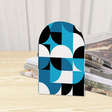 Close-up of the Blue Geometric retro wooden bookend beside stacked magazines