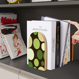 Green Dots retro wooden bookend on a dark shelf with books