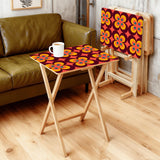 Orange Flower Power retro TV tray set of 4, in a living room beside an olive sofa