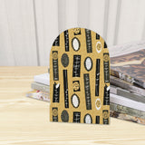 Close-up of the Novelty Shapes retro wooden bookend beside stacked magazines