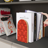 Red Squares retro wooden bookend on a dark shelf with books