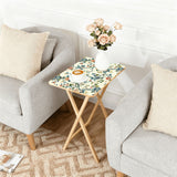 Chinoiserie Blossom retro TV tray set of 4, next to a grey sofa with flowers
