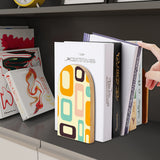 Orange Mod Shapes retro wooden bookend on a dark shelf with books