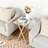 Pastel Leaves retro TV tray set of 4, next to a grey sofa with flowers