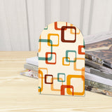 Close-up of the Mod Squares retro wooden bookend beside stacked magazines