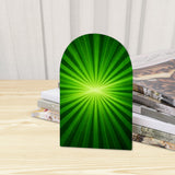 Close-up of the Green Sunburst retro wooden bookend beside stacked magazines