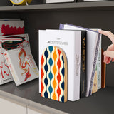Wave Lines retro wooden bookend on a dark shelf with books