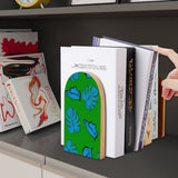 Tropical Leaf retro wooden bookend on a dark shelf with books