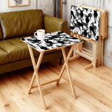 Black White Deer retro TV tray set of 4, in a living room beside an olive sofa