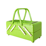 Vintage 1950s lime green sewing or jewelry box – front view, closed, both handles raised