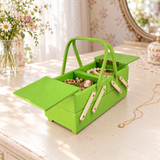 Styled illustration of an open vintage 1950s lime green sewing or jewelry box on a dresser with flowers and a mirror