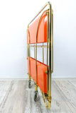 Iconic orange golden 1970s FOLDABLE BAR CART 'Dinett' by Bremshey