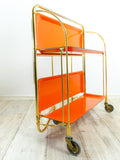 Iconic orange golden 1970s FOLDABLE BAR CART 'Dinett' by Bremshey