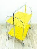 Iconic bright yellow 70s FOLDABLE TROLLEY bar cart Dinett by Bremshey