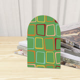 Close-up of the Green Squares retro wooden bookend beside stacked magazines