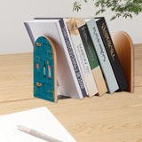 Cocktail Icons retro bookend holding books on a wooden desk next to a pen