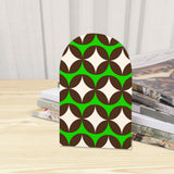 Close-up of the Green Diamond Wave retro wooden bookend beside stacked magazines