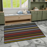 Dark striped area rug 3x5 ft with colorful thin stripes on gray marble flooring by a window bench and green cabinets