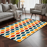 Blue and orange wavy pattern area rug 3x5 ft in a living room with a gray sofa and armchair on dark wood flooring