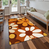 Brown orange daisy pattern area rug 3x5 ft on a wood floor in front of a sofa near a glass door