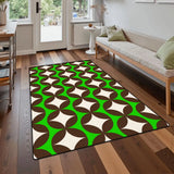 Green and brown geometric area rug 3x5 ft on a wood floor in front of a sofa near a glass door