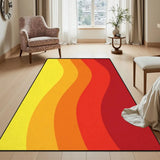 Orange red yellow wave pattern area rug 3x5 ft in a bright room beside a floral armchair and side table