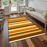 Gold and brown striped area rug 3x5 ft on a wood floor in front of a sofa near a glass door