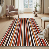 Striped area rug 3x5 ft in red, orange, brown and cream in a bright room beside a floral armchair and side table